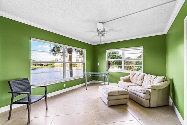 sunroom / solarium featuring a water view and ceiling fan