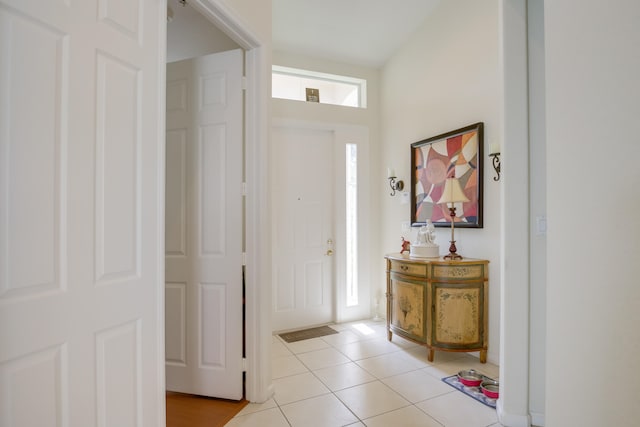 foyer featuring light tile patterned floors