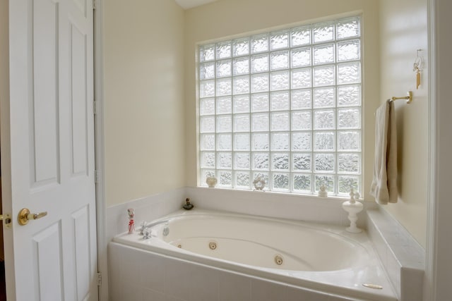 bathroom with tiled bath