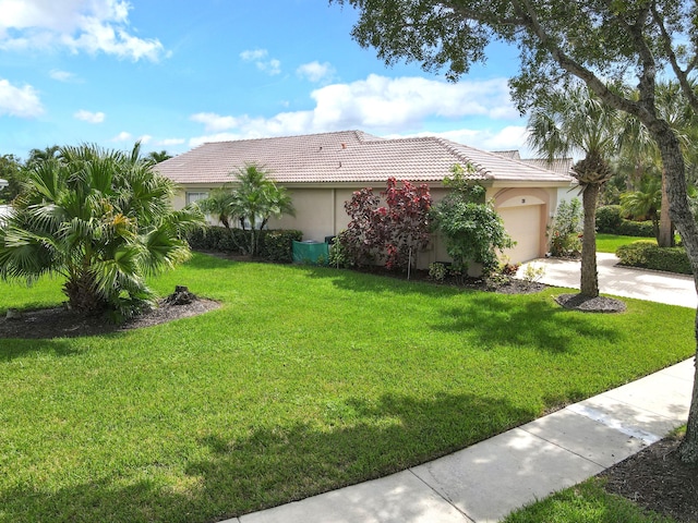 exterior space with a front lawn and a garage