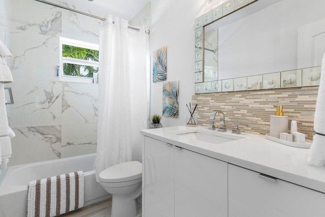 full bathroom featuring tasteful backsplash, vanity, shower / bath combo with shower curtain, wood-type flooring, and toilet