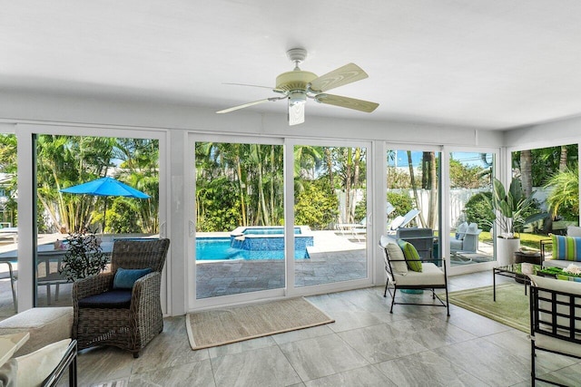 sunroom with ceiling fan