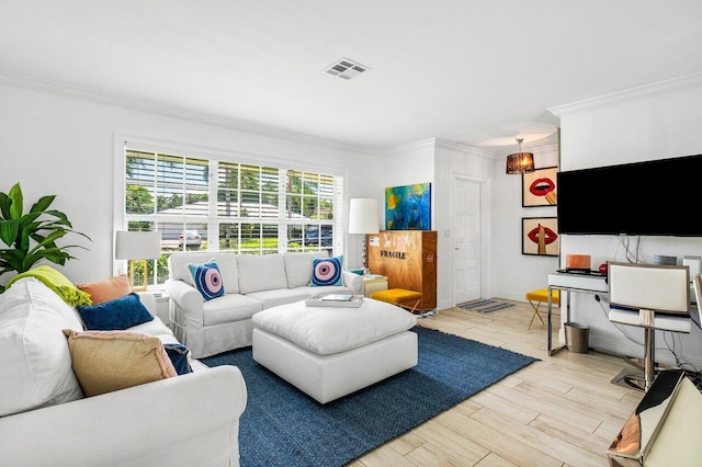 living room featuring light hardwood / wood-style flooring and ornamental molding