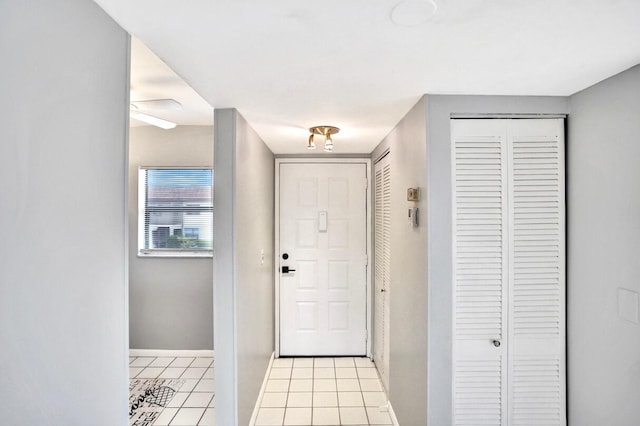 foyer entrance featuring light tile patterned floors