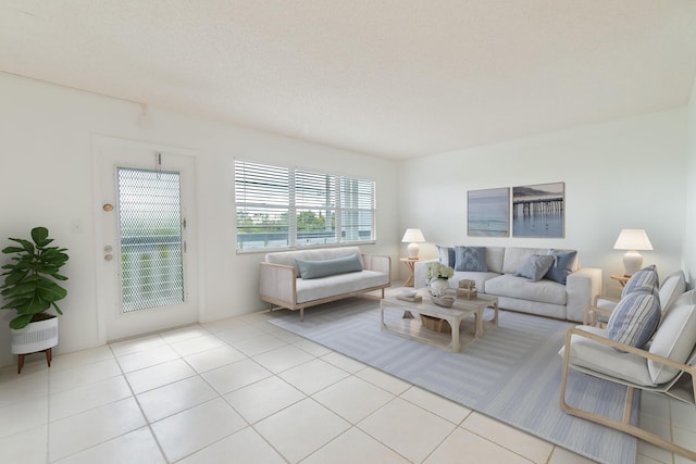 tiled living room featuring a textured ceiling