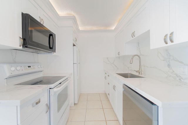 kitchen featuring sink, white cabinets, decorative backsplash, light tile patterned floors, and white appliances