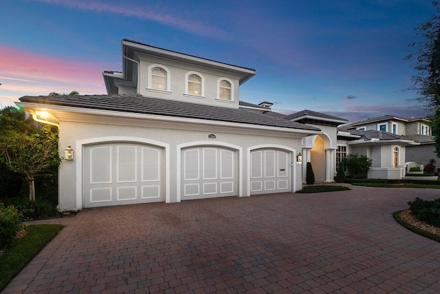 view of front of home with a garage