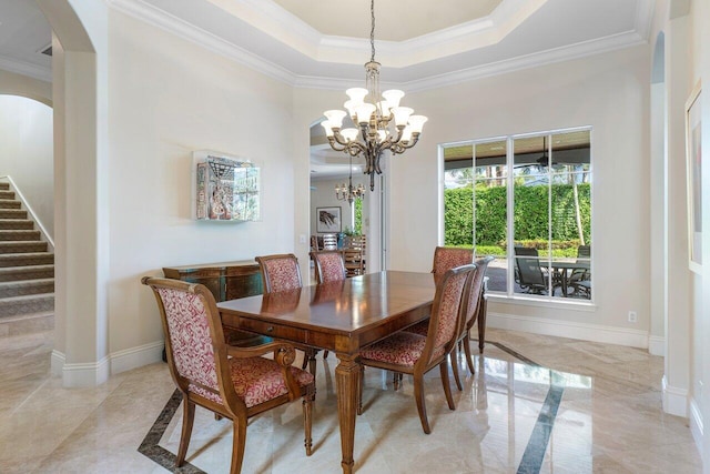 dining space with a chandelier and crown molding