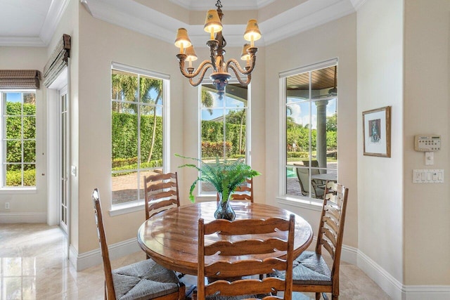 dining room with a wealth of natural light and ornamental molding