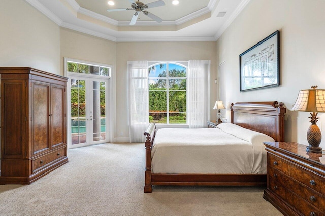 carpeted bedroom with french doors, access to outside, multiple windows, and ceiling fan