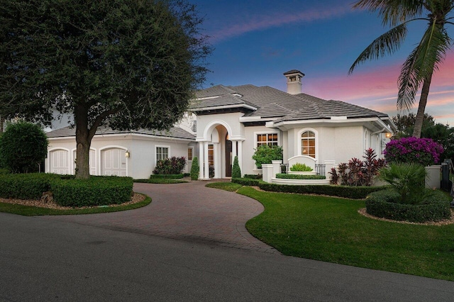 view of front of property with a yard