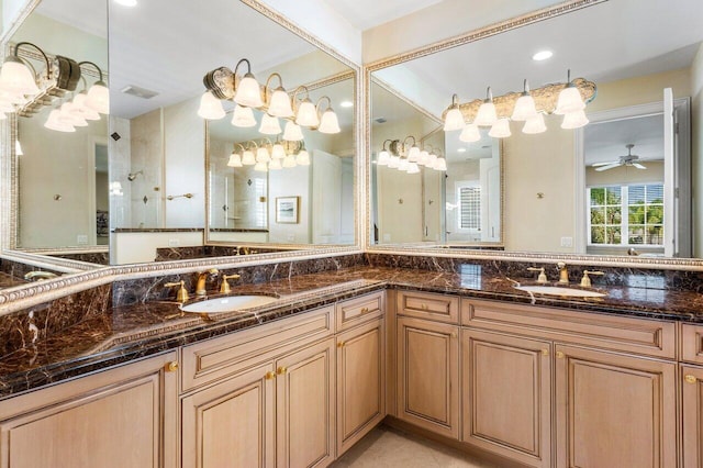 bathroom featuring vanity, ceiling fan, and a tile shower