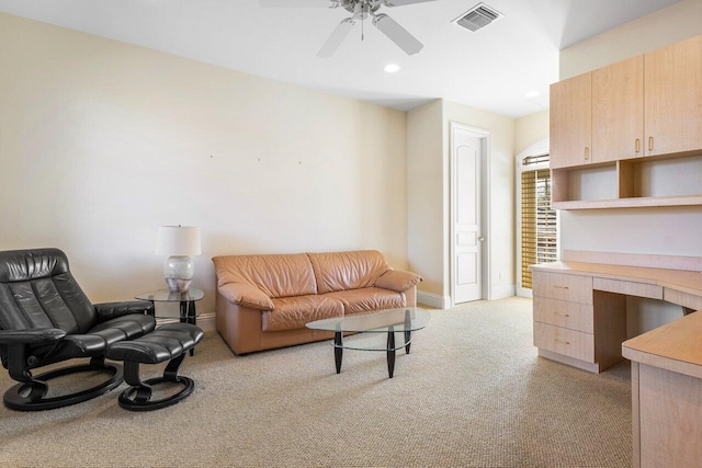 living room featuring ceiling fan and light carpet