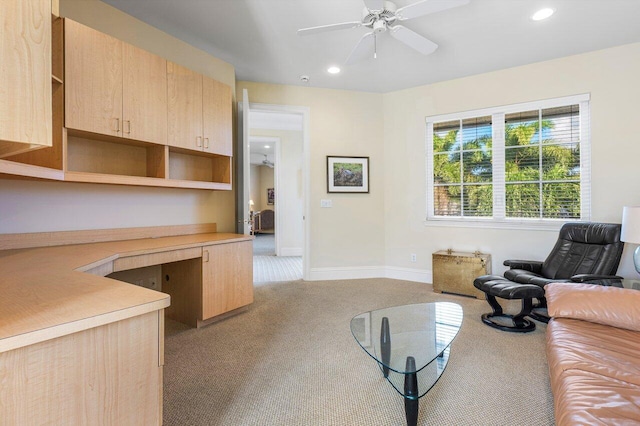 living room with light colored carpet and ceiling fan