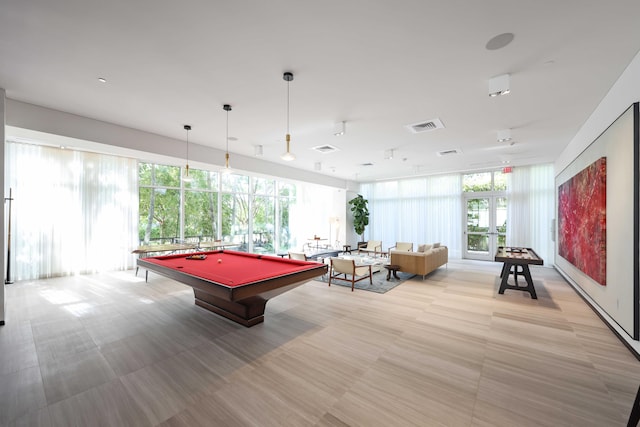 playroom featuring floor to ceiling windows, a wealth of natural light, french doors, and pool table