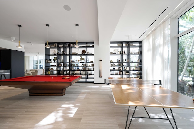 playroom featuring expansive windows and billiards