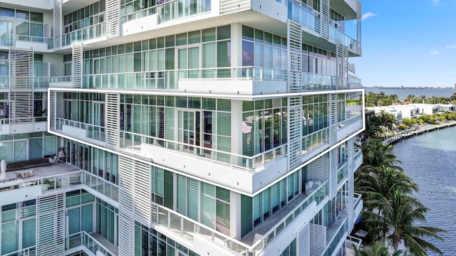 view of building exterior with a water view