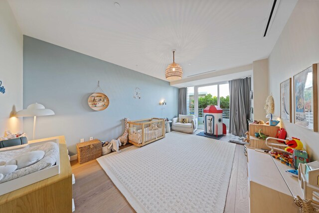 bedroom with light hardwood / wood-style floors