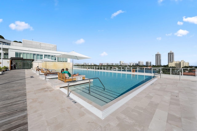 view of pool featuring a patio