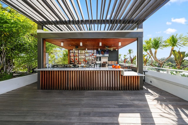 wooden terrace featuring ceiling fan