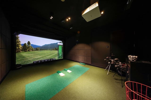 playroom with a mountain view, golf simulator, and carpet floors