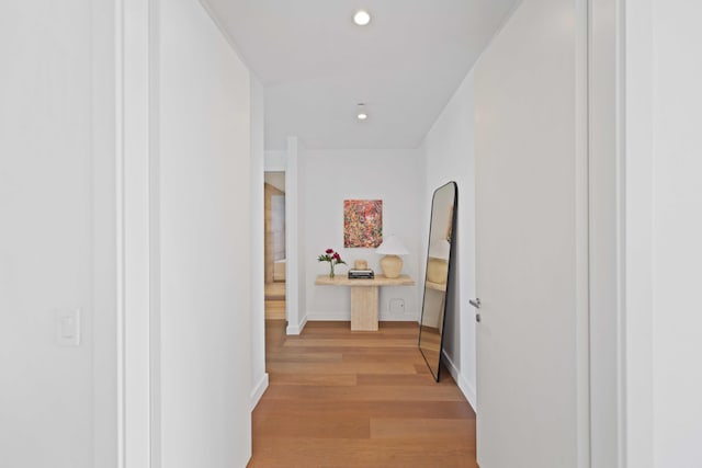 corridor with light wood-type flooring