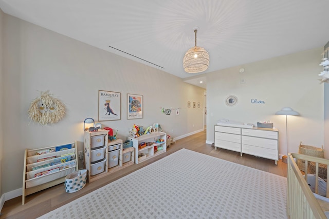 bedroom with hardwood / wood-style floors