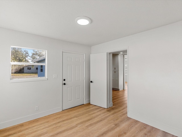 unfurnished room with light hardwood / wood-style floors