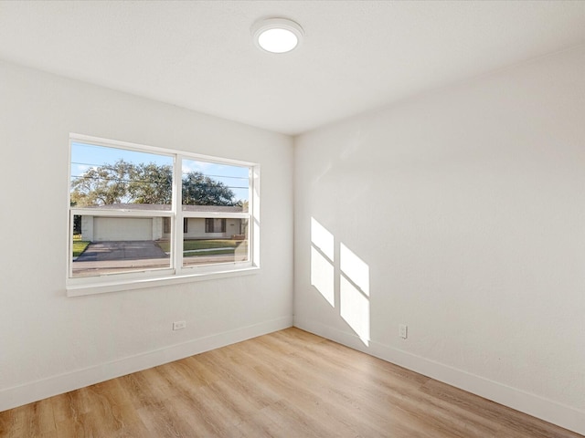 unfurnished room with a wealth of natural light and light wood-type flooring