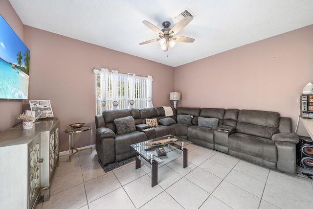 tiled living room featuring ceiling fan