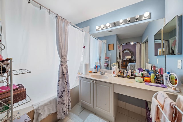 bathroom with tile patterned flooring, vanity, and shower / bathtub combination with curtain