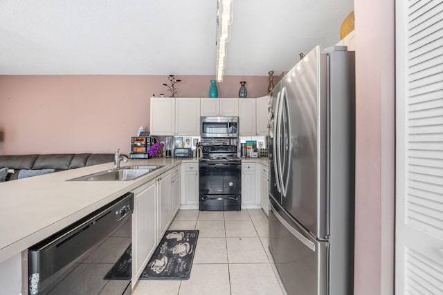 kitchen featuring white cabinets, black appliances, sink, hanging light fixtures, and light tile patterned flooring