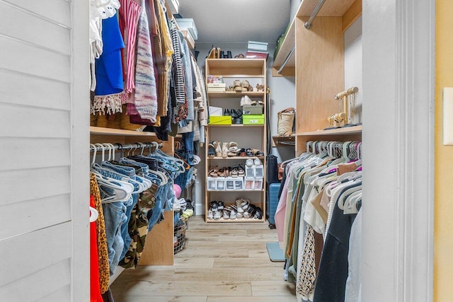 walk in closet featuring light hardwood / wood-style floors