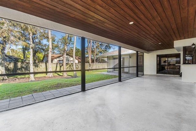 unfurnished sunroom featuring wooden ceiling