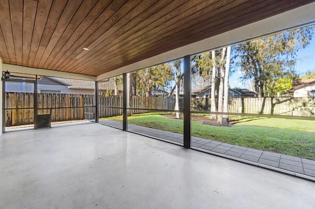 unfurnished sunroom featuring wood ceiling