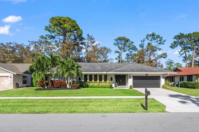 single story home with a front yard and a garage