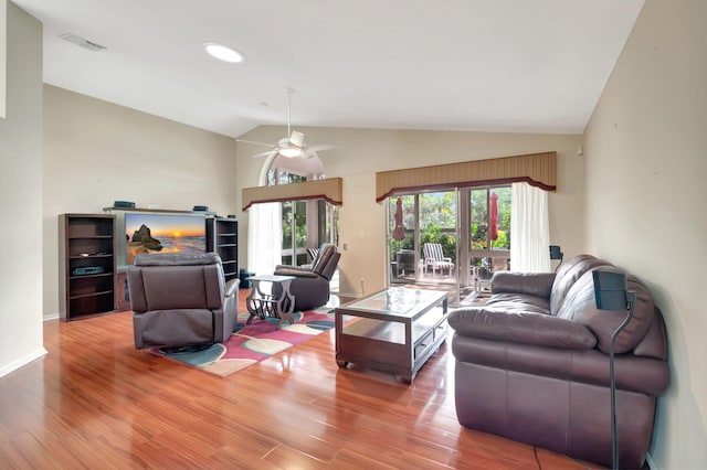 living room with lofted ceiling, wood-type flooring, and ceiling fan