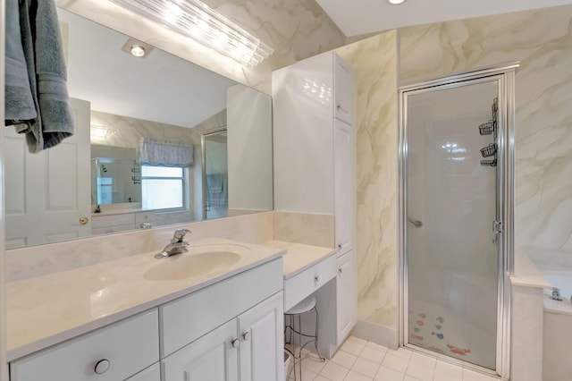 bathroom with an enclosed shower, vanity, and vaulted ceiling