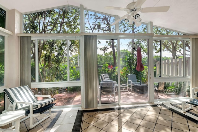 sunroom / solarium with ceiling fan and lofted ceiling