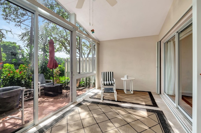 unfurnished sunroom featuring lofted ceiling and ceiling fan