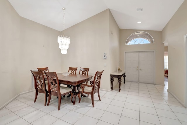 dining space featuring a chandelier and light tile patterned flooring