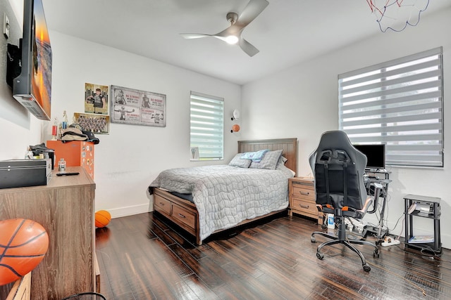 bedroom featuring dark hardwood / wood-style flooring and ceiling fan