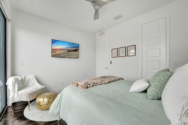 bedroom featuring dark hardwood / wood-style flooring and ceiling fan