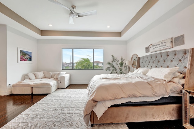 bedroom with hardwood / wood-style flooring and ceiling fan