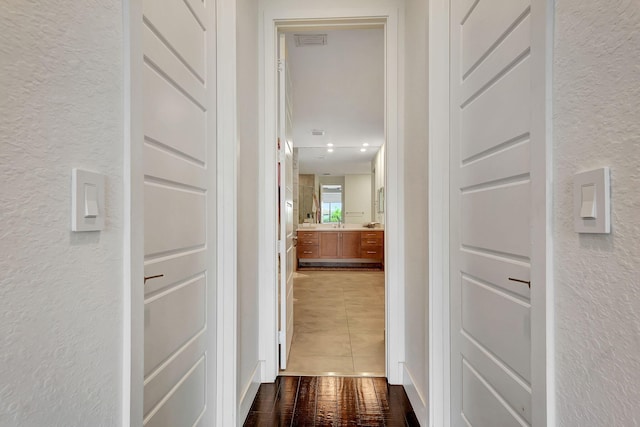 corridor featuring tile patterned floors