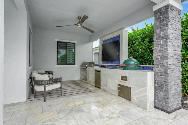 view of patio featuring a grill, an outdoor kitchen, and ceiling fan