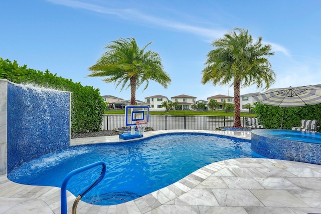 view of pool with a patio and an in ground hot tub