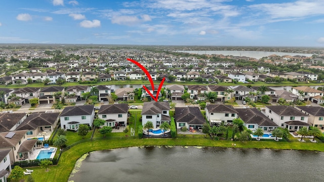 birds eye view of property featuring a water view