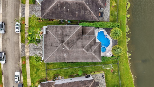 birds eye view of property with a water view