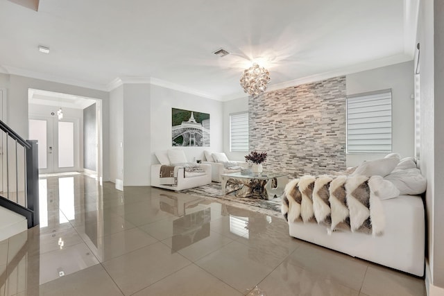 living room with a notable chandelier, tile patterned flooring, and crown molding